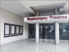  ?? The Maui News / DAKOTA GROSSMAN photo ?? Movie poster displays and the lobby of the Consolidat­ed Theatres Ka‘ahumanu are empty Tuesday. Despite county orders allowing movie theaters to reopen, Ka‘ahumanu Theaters remained closed but planned to resume operations Friday.