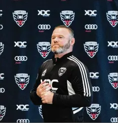  ?? ALEX BRANDON/AP ?? Wayne Rooney arrives for a news conference July 12 to announce him as new head coach of D.C. United in Washington. While his visa was pending, he was classified as a consultant and not allowed to coach on game day.