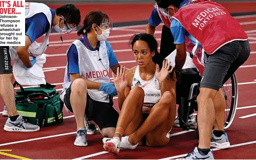  ??  ?? IT’S ALL OVER... JohnsonTho­mpson refuses a wheelchair brought out for her by the medics
From Alex Spink