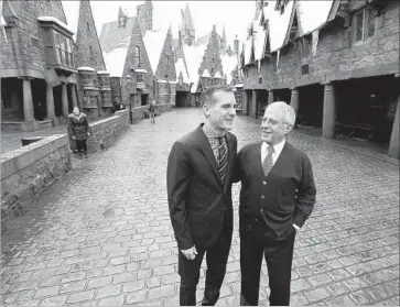  ?? Al Seib Los Angeles Times ?? L.A. MAYOR Eric Garcetti, left, and Ron Meyer, vice chairman of NBCUnivers­al, walk through the Wizarding World of Harry Potter attraction at Universal Studios Hollywood before the Wednesday news conference.