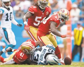  ?? Grant Halverson / Getty Images ?? Antoine Bethea (41) of the 49ers forces a fumble by the Panthers’ Fozzy Whittaker (43) during the loss in Carolina on Sunday. A wrong move by Bethea at another point, however, led to a TD.