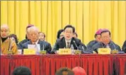  ?? SARA ?? Wang Zuoan (centre) China’s top religious affairs official