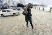  ??  ?? Nicolien van der Merwe walks on the Sea Point promenade.