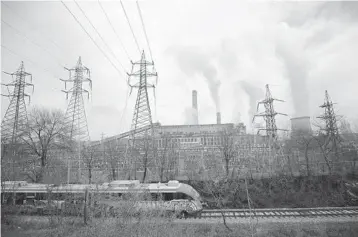  ?? VALENTINA PETROVA/AP ?? A train passes by the Republika Power Plant last month in the town of Pernik, Bulgaria.
