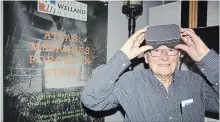  ?? KRIS DUBE
TORSTAR ?? Frank Pisani, a former Atlas Steels employee checks out the virtual reality component of Welland Museum's exhibit that opened Saturday.