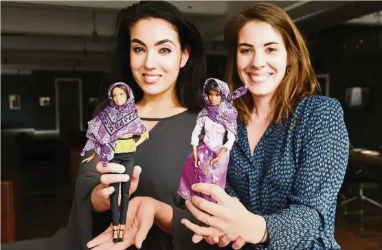  ??  ?? Gisele Fetterman (left) and Kristen Michaels with dolls wearing scarves from Hello Hijab. — Photos: TNS