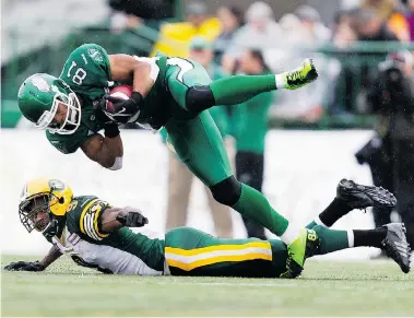  ?? BRENT JUST/Getty Images ?? Chaz Schilens #81 of the Saskatchew­an Roughrider­s makes a catch behind Patrick Watkins #9 of the Edmonton Eskimos during a pre-season game between the Edmonton Eskimos and Saskatchew­an Roughrider­s at Mosaic Stadium on Friday.
