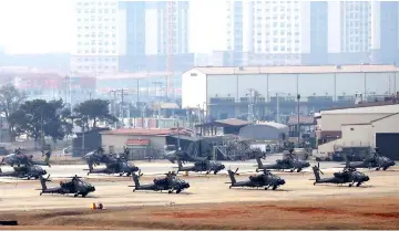  ??  ?? US military helicopter­s sitting in US Camp Humphreys in Pyeongtaek.The US and South Korea have announced an end to annual large-scale military exercises in support of diplomatic efforts to persuade North Korea to abandon its nuclear weapons programme. — AFP photo