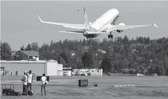  ?? Tribune News Service file photo ?? The final version of the 737 Max, the Max 10, takes off from Renton Airport in Renton, Wash., on its first flight in June 2021. Two 737 Max crashes led to a two-year grounding of the jets.