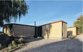  ??  ?? The earth walls of the entrance and garage flank a sheltered courtyard. Right: The den. Below, left: The home overlooks the Wanaka basin. Below, right: Ceilings are lined in New Zealand southern beech.