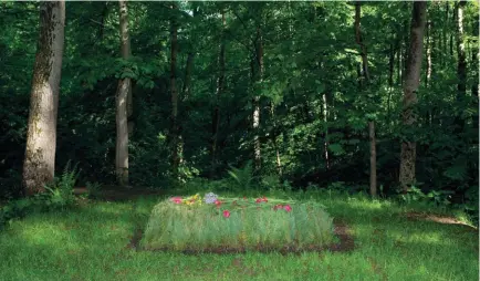  ??  ?? Out for the Count: Tolstoy’s grave at his family home, Yasnaya Polyana, 120 miles south of Moscow