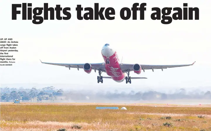  ?? Picture: ALAN BARBER ?? UP, UP AND AWAY: An AirAsia cargo flight takes off from Avalon Airport yesterday, the first internatio­nal flight there for months.