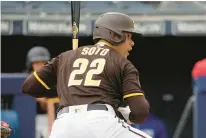  ?? CHARLIE RIEDEL/AP ?? San Diego Padres’ Juan Soto bats during Wednesday’s spring training game against the Texas Rangers in Peoria, Arizona.