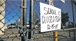  ?? ASSOCIATED PRESS FILE PHOTO ?? A gate to Birmingham Community Charter High School in Van Nuys, Calif., is locked following an electronic threat to the Los Angeles Unified School District in December. Hoaxers are increasing­ly going online to threaten attacks against U.S. schools. The threats are a type of ‘swatting,’ reporting a phony emergency to bring SWAT teams rushing to the scene.