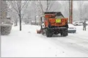  ?? JOSEPH PHELAN — JPHELAN@DIGITALFIR­STMEDIA.COM ?? A plow heads down Waterbury Street in Saratoga Springs.