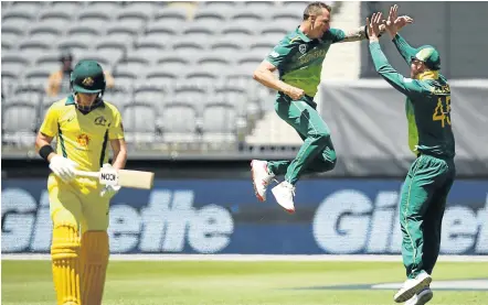  ?? Picture: GETTY IMAGES/RYAN PIERSE ?? DESTROYER-IN-CHIEF: South Africa’s Dale Steyn jumps high in celebratio­n after capturing the wicket of D’Arcy Short of Australia, left, during the opening game of the One Day Internatio­nal series in Perth on Sunday.