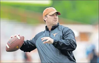  ??  ?? Sterlin Gilbert, now the first-year head coach at McNeese State, was hired to be the Texas offensive coordinato­r in 2016. After only a season, Charlie Strong's entire staff was fired. Still, Gilbert doesn't regret his decision to go to Austin. [AP PHOTO]