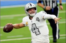  ?? AP PHOTO/ALEX GALLARDO ?? Las Vegas Raiders quarterbac­k Derek Carr throws a pass during the second half of an NFL football game against the Los Angeles Chargers, Sunday, in Inglewood, Calif.