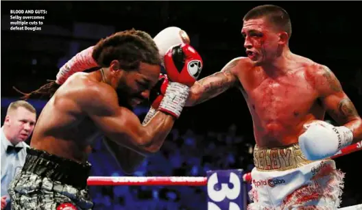  ??  ?? BLOOD AND GUTS: Selby overcomes multiple cuts to defeat Douglas