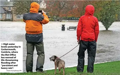  ?? Owen Humphreys/PA ?? High water levels yesterday in Cockermout­h, Cumbria, where the Met Office has warned of life-threatenin­g flooding after “persistent and heavy rain”.