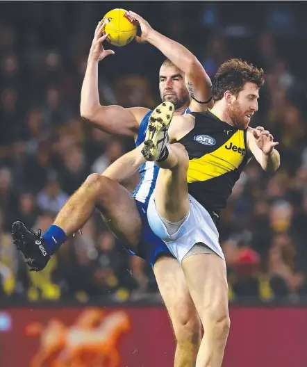  ?? Picture: GETTY IMAGES ?? Ben Cunnington was a star for North Melbourne but Reece Conca and the Tigers got the win.