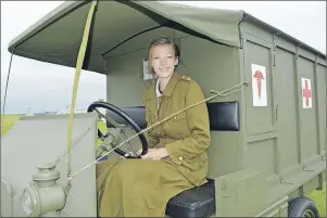  ?? CHRIS SHANNON/CAPE BRETON POST ?? Animator Lyndsey Friesen sits in a 1918 Ford Ambulance. It was one of eight separate displays as part of the First World War Comes to Life exhibit currently touring Atlantic Canada.