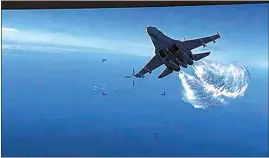  ?? US DEPARTMENT OF DEFENSE VIA AP ?? This photo taken from video released on Thursday, shows a Russian Su-27 approachin­g the back of the MQ-9 drone and beginning to release fuel as it passes, over the Black Sea, the Pentagon said.