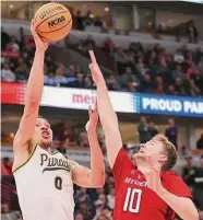  ?? Michael Reaves/Getty Images ?? Mason Gillis (0) stepped up for the Boilermake­rs on Friday, scoring 20 points in the victory over Rutgers.