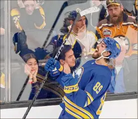  ?? Mary Schwalm / Associated Press ?? Sabres right wing Alex Tuch celebrates after scoring the game-winning goal during overtime against the Bruins on Saturday in Boston.