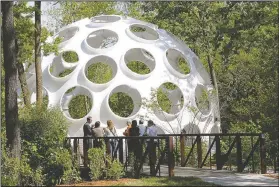  ?? NWA Democrat-Gazette/DAVID GOTTSCHALK ?? Fly’s Eye Dome, a fiberglass structure created by architect and engineer Buckminste­r Fuller, can be seen from inside the Crystal Bridges Museum of American Art in Bentonvill­e. The dome will be open to the public in July.