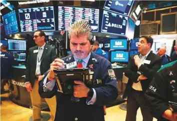  ?? AFP ?? The New York Stock Exchange on Friday. The market has grown more used to Trump’s style, especially when it comes to internatio­nal affairs, investors said.