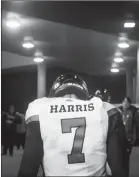  ?? Canadian Press photo ?? Ottawa Redblacks quarterbac­k Trevor Harris walks to the dressing room after losing to the Calgary Stampeders during the 106th Grey Cup in Edmonton Sunday.