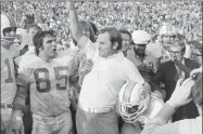  ?? Anonymous / Associated Press ?? In this Jan. 13, 1973 file photo, Miami Dolphins coach Don Shula lets out with a roar as the gun sounds to give the Dolphins a 14-7 Super Bowl victory over the Washington Redskins in Los Angeles. Shula coached the 1972 Dolphins to a 17-0 record.