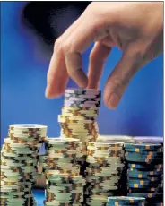  ?? AP FILE PHOTO ?? Caesars Entertainm­ent Inc. has announced it plans to return to live, in-person World Series of Poker play for a nearly eight-week tournament in Las Vegas later this year.