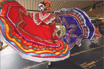  ?? (NWA Democrat-Gazette File Photo/Flip Putthoff) ?? Ballet Folklorico Herencia de Mexico will perform on May 5 as part of the Cinco De Mayo Fiesta in downtown Rogers. This will be the first event of the year for the Railyard Live series. The evening kicks off at 5 p.m. and will feature authentic Mexican music, dance, and food presented in collaborat­ion with Papa Rap.