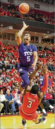 ?? JOHN WEAST / GETTY IMAGES ?? Kendric Davis of the TCU Horned Frogs is called for the offensive foul against Deshawn Corprew of Texas Tech in January. Davis scored 22 points Saturday as TCU beat Iowa State 92-83.