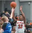  ?? GENE WALSH — DIGITAL FIRST MEDIA ?? Plymouth Whitemarsh’s Lainey Allen shoots over Norristown’s Brooke Heim Friday night.