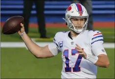  ?? JEFFREY T. BARNES - THE ASSOCIATED PRESS ?? Buffalo Bills quarterbac­k Josh Allen passes during the first half of an NFL football game against the Los Angeles Chargers, Sunday, Nov. 29, 2020, in Orchard Park, N.Y.