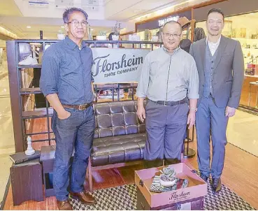  ??  ?? Florsheim business developmen­t and brand manager Manny Concepcion, Florsheim COO Albert Wong and Florsheim Asia Pacific GM Zack Ku help customers get into the pop-up spirit at Glorietta 4.