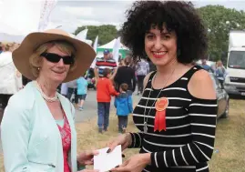  ?? Photos: Michael McGrath ?? Right: Winner of the Best Dressed Lady competitio­n at Charlevill­e show was Mary Cunningham, pictured accepting her prize from the judge Anna Rooney.