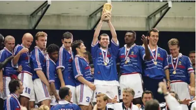  ??  ?? France's Zinedine Zidane lifts the World Cup trophy as France become World champions. France beat Brazil 3-0 at the 1998 World Cup Final, played in St, Denis, France, on the 12th July, 1998. Photo: FIFA