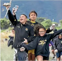  ??  ?? Hunter Jackson, 9, far left, Paige Lilo, 11, and Anahera McLean, 11, are seeking sponsorshi­p for good deeds, including cleaning up Petone beach.