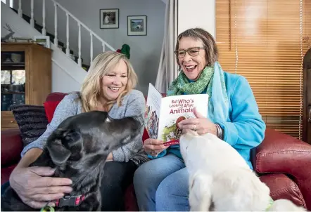  ?? BRADEN FASTIER/STUFF ?? Author Renee Lang, right, and illustrato­r Polly Rabbits say the work of an animal welfare group during the Pigeon Valley wildfire lent itself to a children’s book.