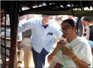  ?? ANI ?? West Bengal Chief Minister Mamata Banerjee drinks tea from a stall during her visit to Shantinike­tan in Birbhum on Wednesday.