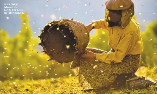  ?? Ljubo Stefanov Neon ?? HATIDZE Muratova tends her bees in “Honeyland.”