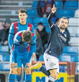  ?? ?? Paul McMullan salutes the fans after scoring.