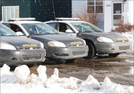  ?? SHARON MONTGOMERY-DUPE - CAPE BRETON POST ?? Three police cars block off Newton Street, Glace Bay, on Friday afternoon, in front of a house where a stabbing had taken place. A woman was arrested and a man transporte­d to hospital with non-life threatenin­g injuries.