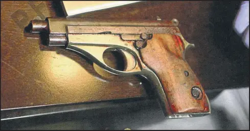  ?? CEDOC ?? The gun that killed Alberto Nisman, photograph­ed in the immediate aftermath of the late AMIA special prosecutor’s death at the scene of the crime.