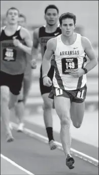  ?? NWA Media/ANDY SHUPE ?? Arkansas’ Kevin Lazas leads the pack during the 1,000-meter portion of the heptathlon Saturday in the Razorback Invitation­al at the Randal Tyson Track Center in Fayettevil­le. Lazas won the race and the event, setting a school record with 6,042 points.