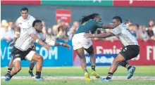  ?? Photo: Ian Muir ?? Fiji Airways Fijian 7s team in action against South Africa in the cup semi-final of the Dubai 7s on December 3, 2017.